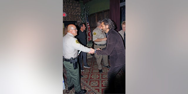 John Stamos shakes former Malibu/Lost Hills Sheriff's station Captain Chuck Becerra at benefit.