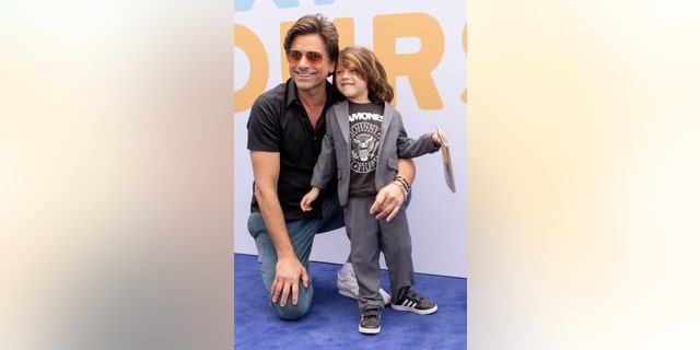 John Stamos hopes to instill community values in his son Billy.