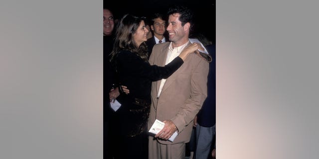 Kirstie Alley and actor John Travolta attend the "Look Who's Talking" Beverly Hills premiere in 1989.