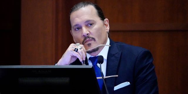 Actor Johnny Depp testifies in Fairfax County Circuit Court in Fairfax, Virginia, April 25, 2022.