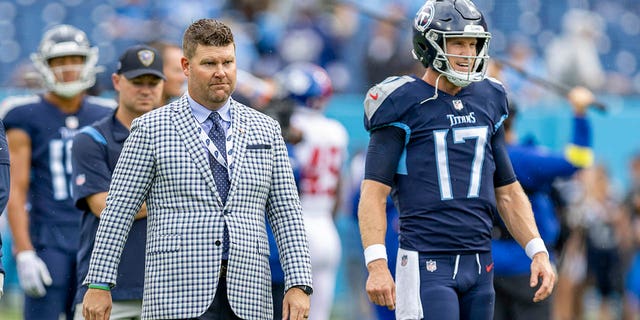 General Manager Jon Robinson with Ryan Tannehill, #17 of the Tennessee Titans, on the field before a game against the New York Giants at Nissan Stadium on Sept. 11, 2022 in Nashville, Tennessee.