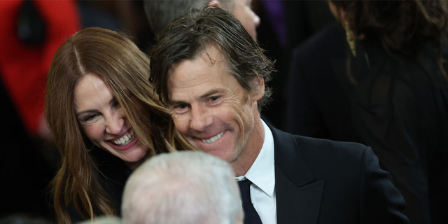 Actress Julia Roberts and her husband, cinematographer Daniel Moder, were seen smiling and enjoying a reception for an event at the White House on Sunday.