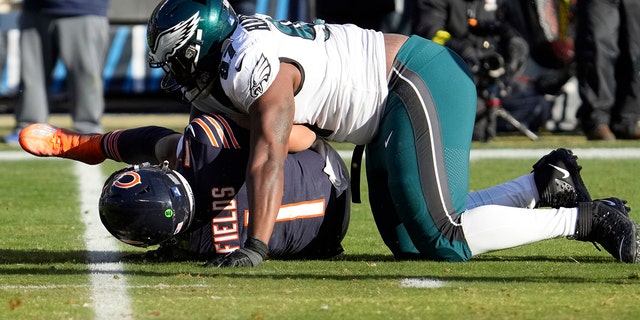 Philadelphia Eagles' Javon Hargrave sacks the Bears' Justin Fields, Sunday, Dec. 18, 2022, in Chicago.