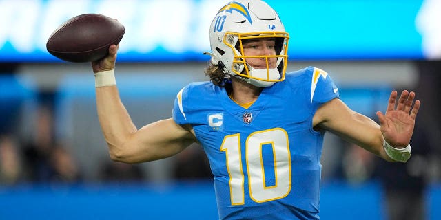 Los Angeles Chargers quarterback Justin Herbert throws during the first half of an NFL football game against the Miami Dolphins Sunday, Dec. 11, 2022, in Inglewood, Calif.