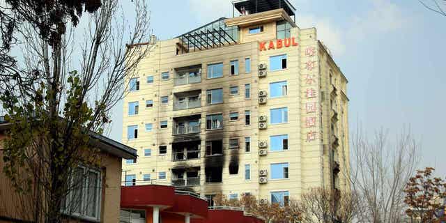 A hotel building following an Islamic State-claimed bombing in Kabul, Afghanistan on December 13, 2022. China has warned citizens to leave the country after the bombing.