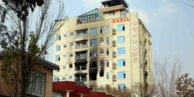 A hotel building following an Islamic State-claimed bombing in Kabul, Afghanistan on December 13, 2022. China has warned citizens to leave the country after the bombing.