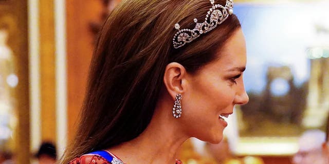 Princess Kate Middleton upstaged Meghan Markle's look on Tuesday by wearing a tiara to the Diplomatic Corps reception.
