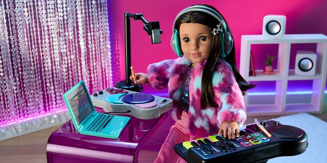 American Girl of the Year, Kavi, practices song producing.