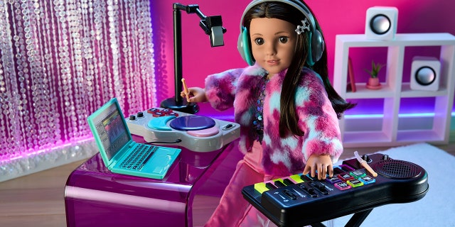 American Girl of the Year, Kavi, practices song producing.