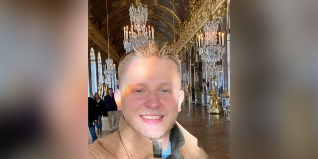 Ken DeLand smiling in a photo on his Instagram story from Versailles. 