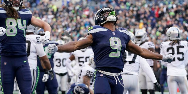 Seattle Seahawks running back Kenneth Walker III, #9, celebrates his rushing touchdown against the Las Vegas Raiders during the second half of an NFL football game Sunday, Nov. 27, 2022, in Seattle. 