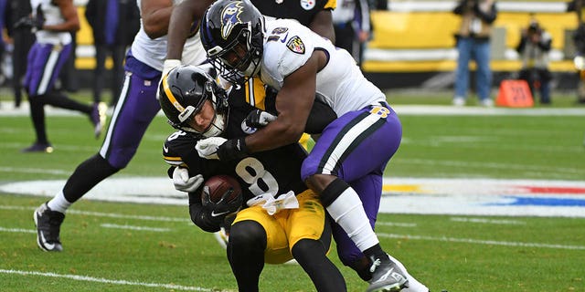 Steelers quarterback Kenny Pickett is tackled by Baltimore Ravens linebacker Roquan Smith in Pittsburgh, Dec. 11, 2022.