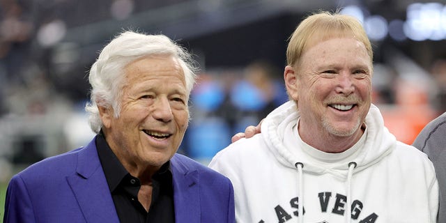 NFL team owners Robert Kraft and Mark Davis on the sidelines before a game