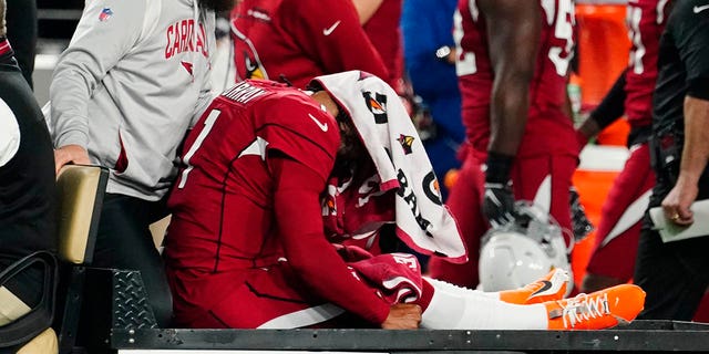 Arizona Cardinals quarterback Kyler Murray (1) is carted off the field after an injury during the first half of a game against the New England Patriots Dec. 12, 2022, in Glendale, Ariz. 
