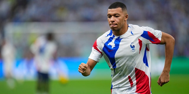 France's Kylian Mbappe warms up before the World Cup final soccer match against Argentina in Lusail, Qatar, Sunday, Dec.18, 2022.