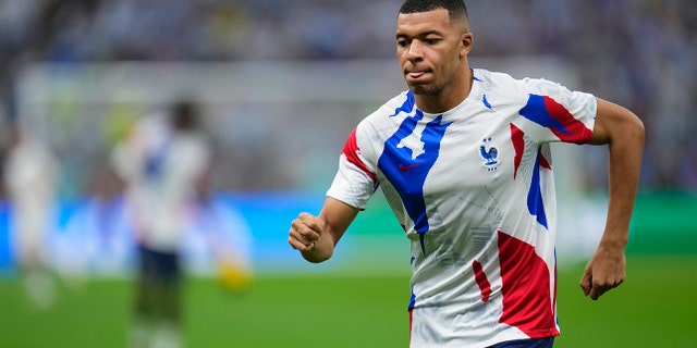 France's Kylian Mbappe warms up before the World Cup final soccer match against Argentina in Lusail, Qatar, Sunday, Dec.18, 2022.