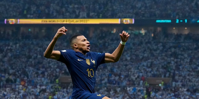 France's Kylian Mbappe celebrates scoring his side's second goal during the World Cup final match against Argentina, Sunday, Dec. 18, 2022.