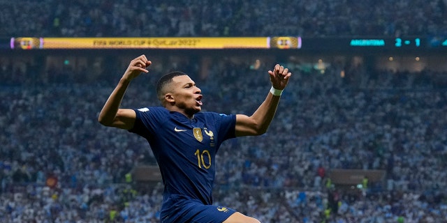 France's Kylian Mbappe celebrates scoring his side's second goal during the World Cup final match against Argentina, Sunday, Dec. 18, 2022.