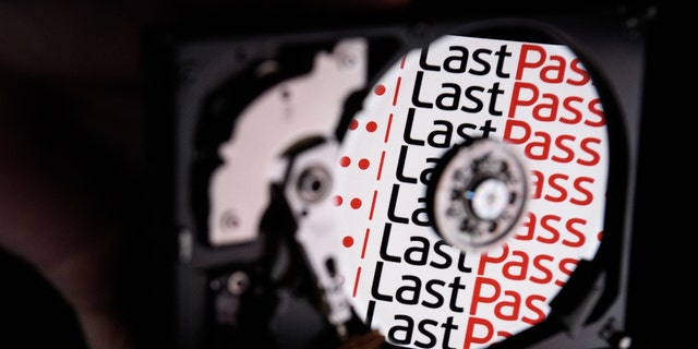 In this photo illustration, the logo for online password manager service LastPass is reflected on the internal discs of a hard drive Aug. 9, 2017, in London. 