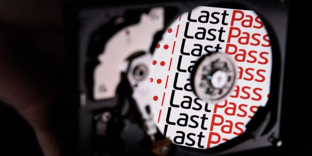 In this photo illustration, the logo for online password manager service LastPass is reflected on the internal discs of a hard drive.