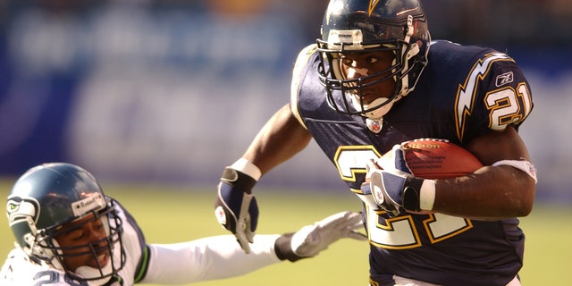 Chargers' LaDainian Tomlinson runs against Seattle Seahawks at the Qualcomm Stadium, Dec. 29, 2002, in San Diego.