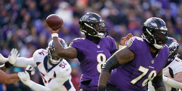 Baltimore Ravens quarterback Lamar Jackson (8) looks to pass in the first half of an NFL football game against the Denver Broncos, Sunday, Dec. 4, 2022, in Baltimore. 