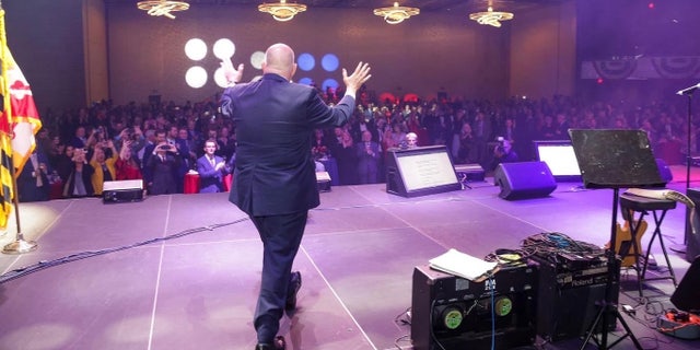 Term-limited Republican Gov. Larry Hogan takes to the stage at a celebration of his eight years steering the blue state of Maryland, at an event in Baltimore, Maryland on Nov. 30, 2022