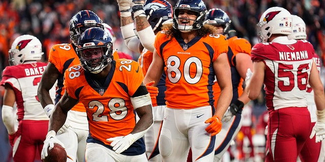 Denver Broncos running back Latavius Murray (28) celebrate his touchdown against the Arizona Cardinals during the second half of an NFL football game, Sunday, Dec. 18, 2022, in Denver. 