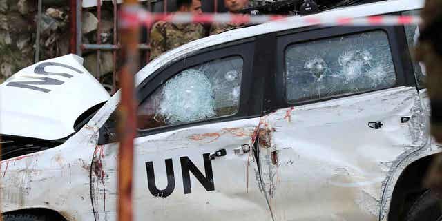 A damaged United Nations peacekeeper vehicle is shown at the scene where a United Nations peacekeeper convoy was attacked in the Al-Aqbiya village, in south Lebanon, on Dec. 15, 2022. 