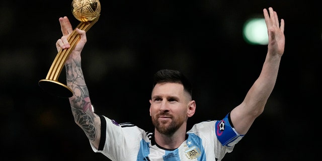 Argentina's Lionel Messi waves after receiving the Golden Ball award for best player of the tournament at the end of the World Cup final soccer match between Argentina and France at Lusail Stadium in Lusail, Qatar, Sunday, Dec. 18, 2022.