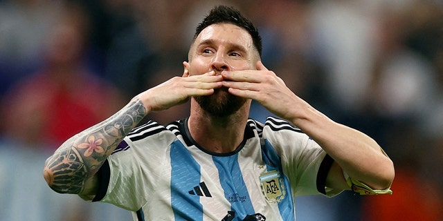 Argentina's Lionel Messi celebrates after Julian Alvarez scores.