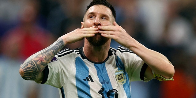 Argentina's Lionel Messi celebrates after Julian Alvarez scores their third goal.