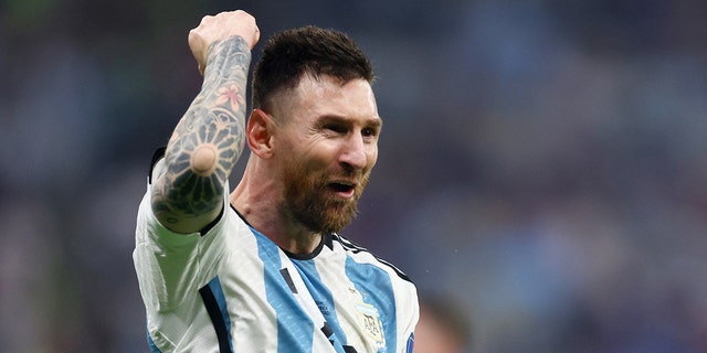 Argentina's Lionel Messi celebrates scoring their third goal.