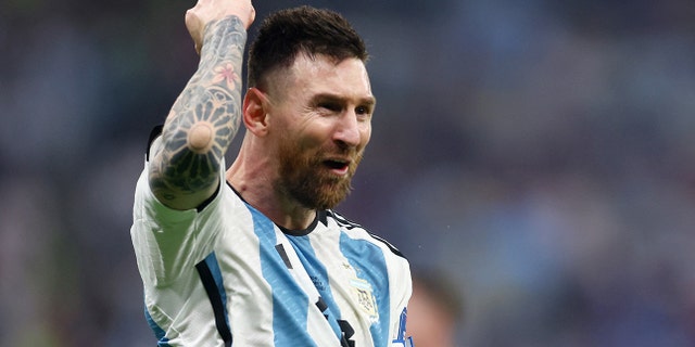 Argentina's Lionel Messi celebrates scoring their third goal.