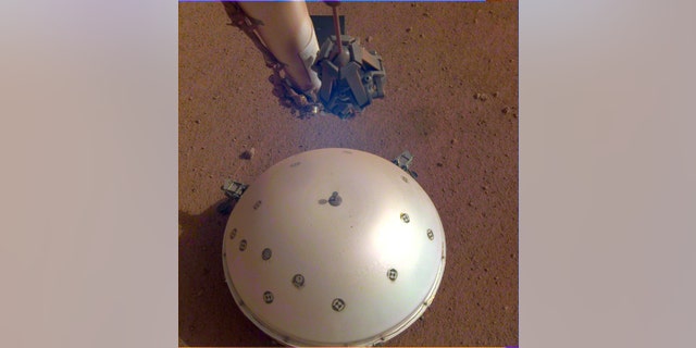 This image shows the domed Wind and Thermal Shield surrounding InSight's Seismic Experiment for Interior Structure, or SEIS, seismometer.