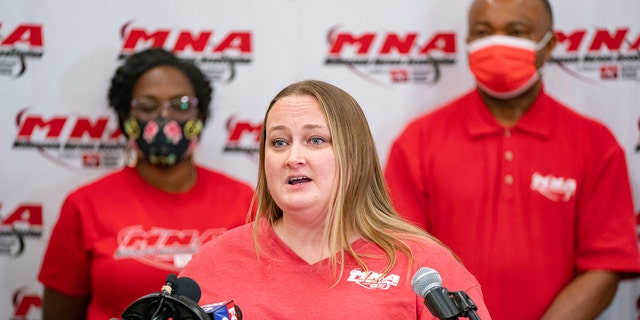Angela Becchetti, a registered nurse from Abbott Northwestern- Alina, speaks at a press conference announcing the intent for the nurses to strike Thursday, Dec.1, 2022 at the Minnesota Nurses Association in St. Paul, Minn. 