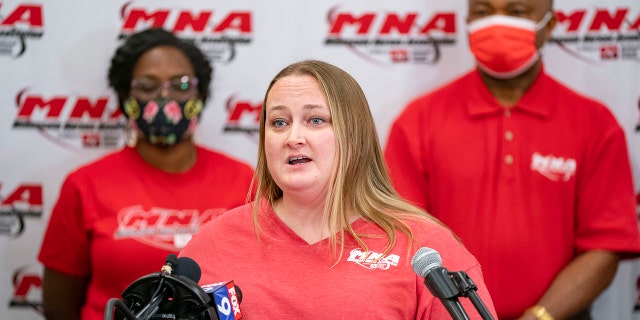 Angela Becchetti, a registered nurse from Abbott Northwestern- Alina, speaks at a press conference announcing the intent for the nurses to strike Thursday, Dec.1, 2022 at the Minnesota Nurses Association in St. Paul, Minn. 