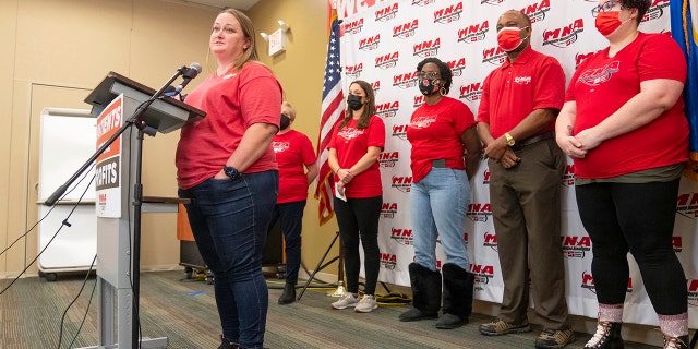 Angela Becchetti, a registered nurse from Abbott Northwestern- Alina, speaks at a press conference announcing the intent for the nurses to strike Thursday, Dec. 1, 2022 at the Minnesota Nurses Association in St. Paul, Minn.