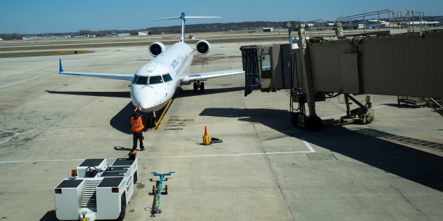 A plane arrives at a docking bay April 18, 2014, at the Madison, Wisconsin airport. 