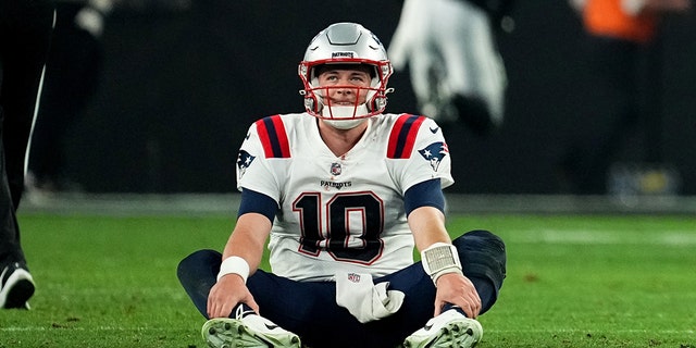 Mac Jones #10 of the New England Patriots looks on after losing to the Las Vegas Raiders at Allegiant Stadium on December 18, 2022 in Las Vegas, Nevada.
