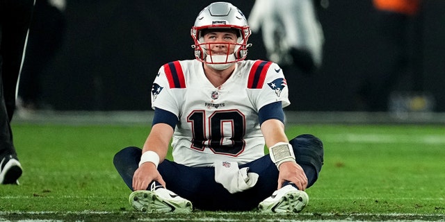 Mac Jones #10 of the New England Patriots looks on after losing to the Las Vegas Raiders at Allegiant Stadium on December 18, 2022 in Las Vegas, Nevada.