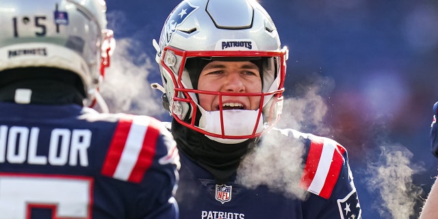 Dec 24, 2022; Foxborough, Massachusetts, USA; New England Patriots quarterback Mac Jones (10) warms up before the start of the game against the Cincinnati Bengals at Gillette Stadium. 