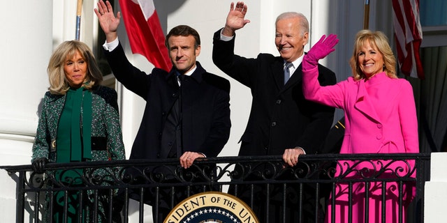 President Joe Biden and First Lady Jill Biden with French President Emmanuel Macron and his wife, Brigitte Macron, wave from the Blue Room Balcony during a State Arrival Ceremony on the South Lawn of the White House in Washington, Thursday, Dec. 1, 2022.