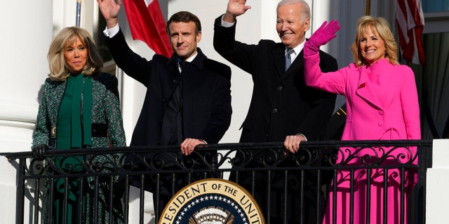 President Joe Biden and first lady Jill Biden with French President Emmanuel Macron and his wife Brigitte Macron wave from the Blue Room balcony during a State Arrival Ceremony on the South Lawn of the White House in Washington, Thursday, Dec. 1, 2022.