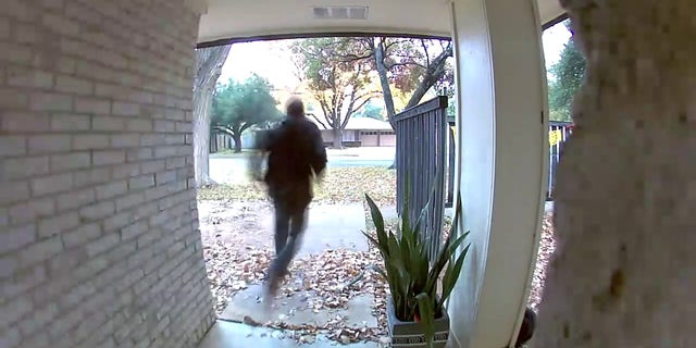 Foster's Blink surveillance camera shows the barefoot thief darting away from her home.
