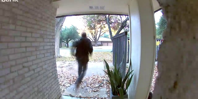 Foster's Blink surveillance camera shows the barefoot thief darting away from her home.