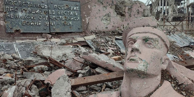 Russia to safe stronghold over Mariupol by stripping Ukrainian id, constructing over devastation 2 The remains of a statue and other rubble lie in front of the Azovstal Steel Mill, which was the last place in the Ukrainian city of Mariupol to fall to Russian forces in late May 2022.