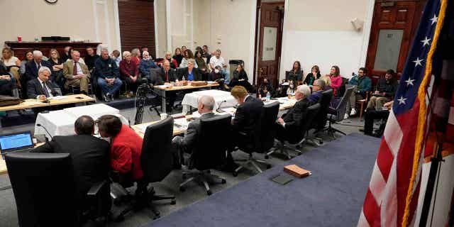 A Statehouse panel meets on Dec. 13, 2022, in Boston, to weigh whether to approve Massachusetts Gov. Charlie Baker's recommended pardons of two individuals involved in one of the nation's most high-profile sexual abuse trials of the 1980s.