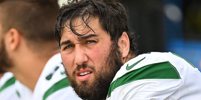 Max Mitchell #61 of the New York Jets looks on during the game against the Pittsburgh Steelers at Acrisure Stadium on October 2, 2022, in Pittsburgh.