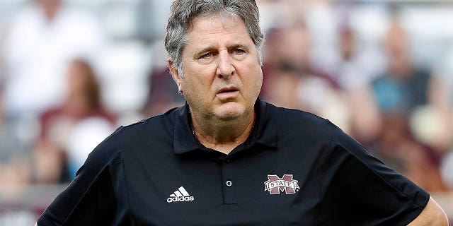 Head coach Mike Leach of the Mississippi State Bulldogs watches his players warm up before playing the Aggies at Kyle Field on Oct. 2, 2021, in College Station, Texas.